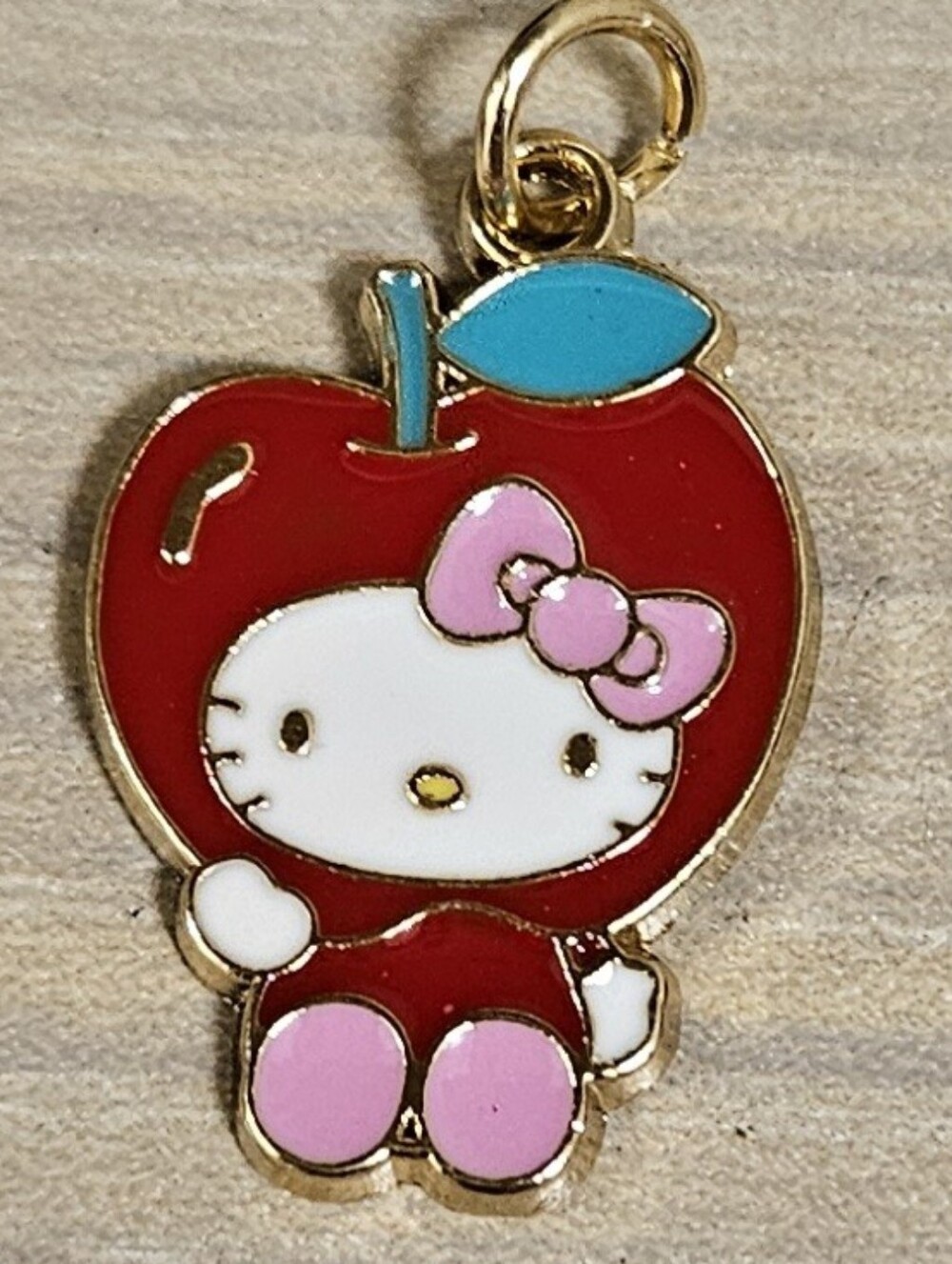 SANRIO HELLO KITTY APPLE ENAMEL GOLD-TONE PENDANT CHARM